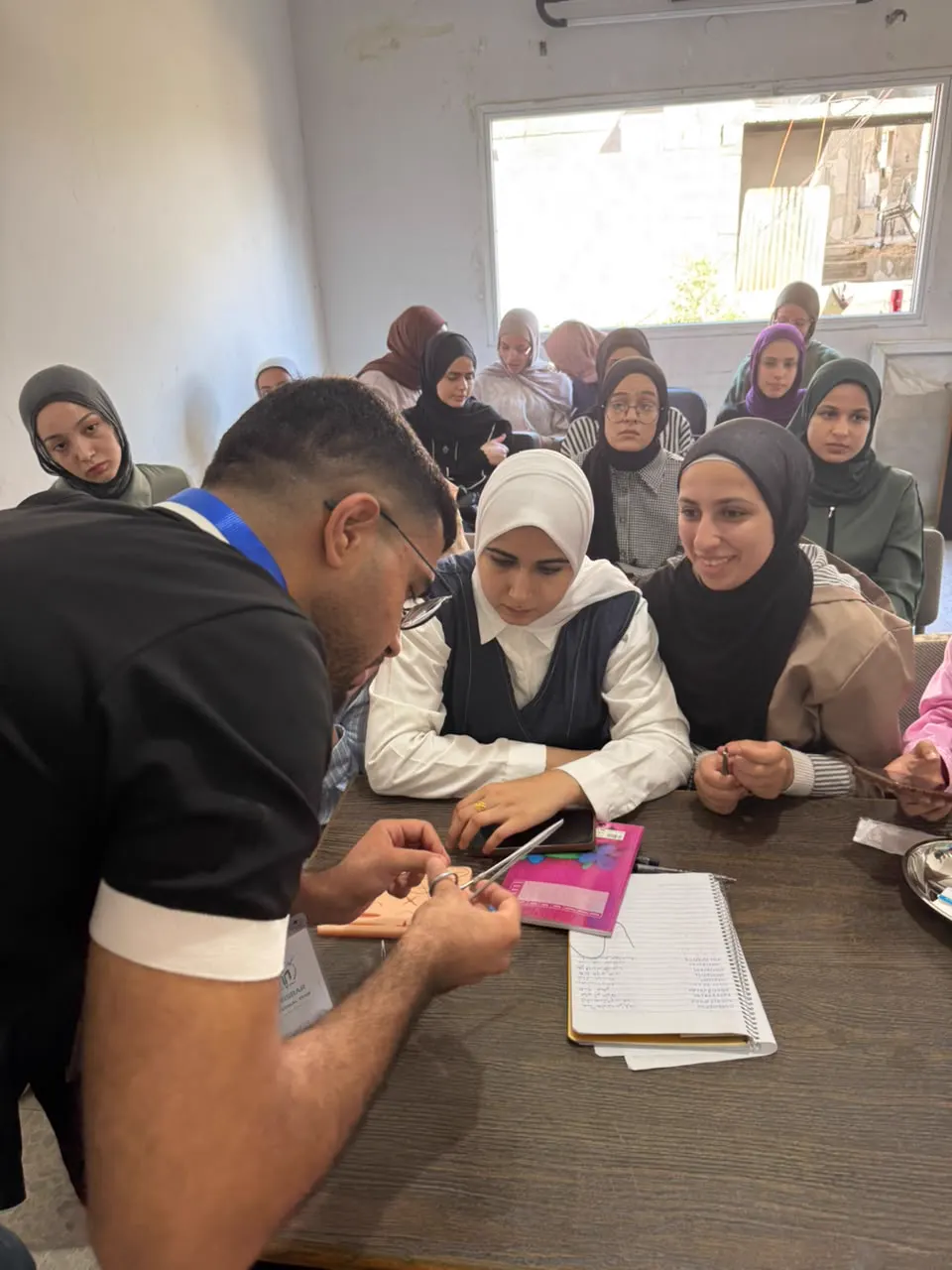 A trainer explaining a technique to students