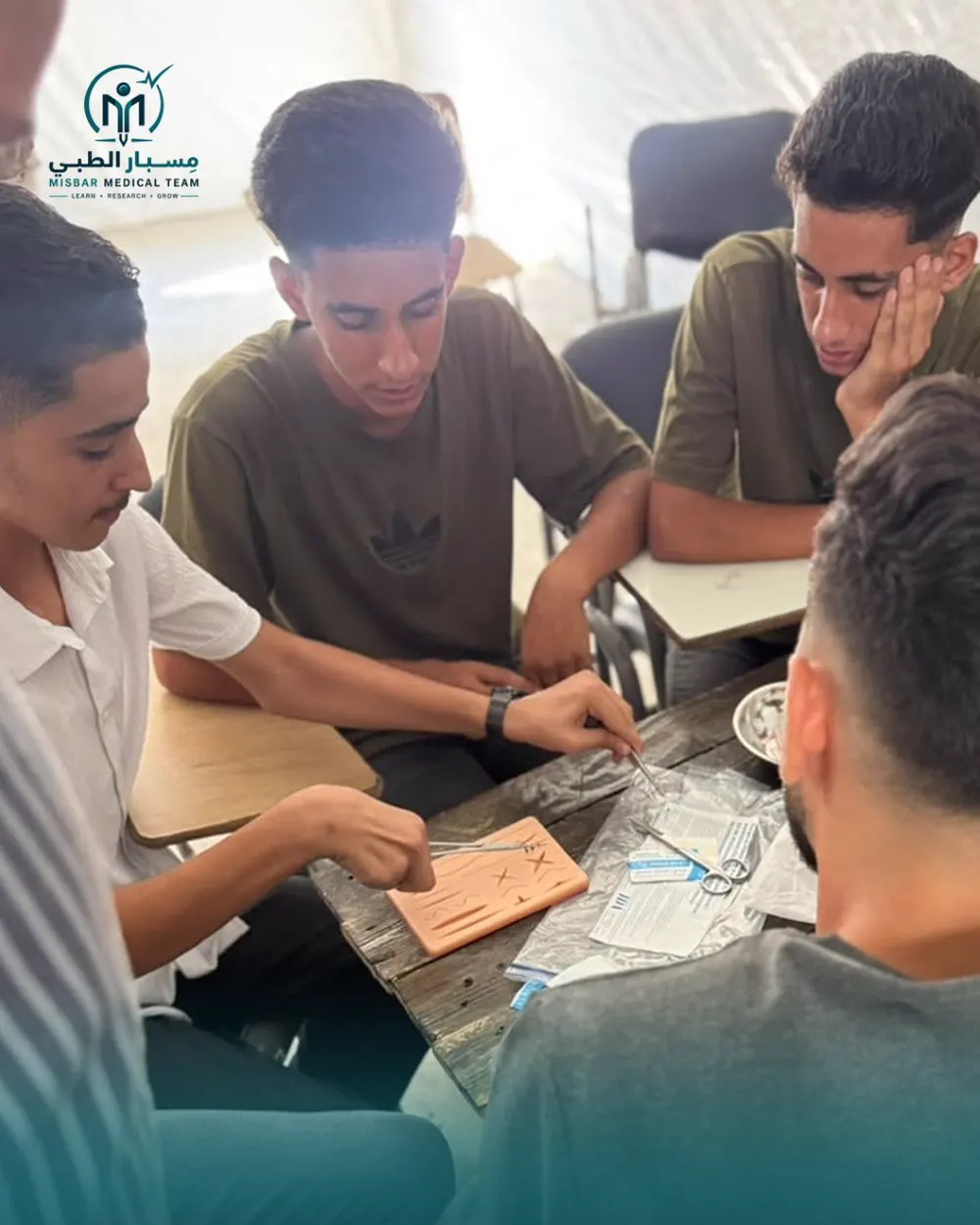 Students practising surgical suturing
